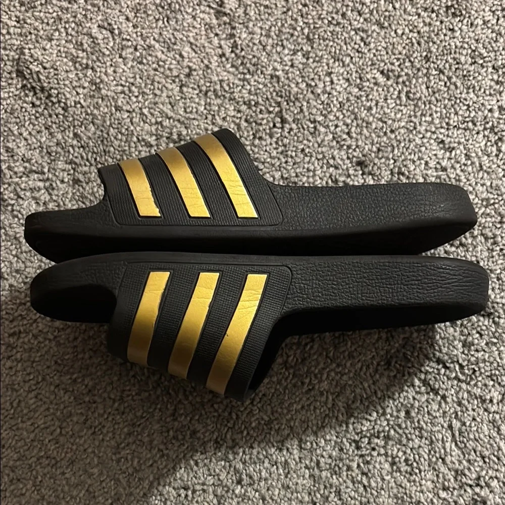 adidas Black Slide Sandals with Metallic Gold Stripes